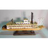 'The Queen of Mississipi', a modern wooden model of a paddle boat, 70cm wide x 35cm high.