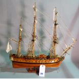 A modern wooden model of a triple mast galleon,