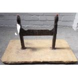 A Victorian cast iron boot scraper with pointed finials, set into a rectangular stone slab, 63.