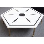 A 20th century coffee table, the inlaid octagonal marble top on six reeded brass supports,