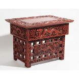 A 20th century Chinese scarlet lacquered stand, with dragon carved decoration,