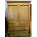 A Victorian ash linen press, the pair of panel doors over two short and two long drawers,