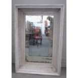 A modern distressed white painted rectangular wall mirror,