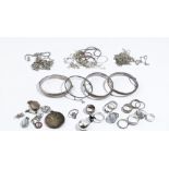 Mostly silver jewellery, comprising: fifteen rings, four bangles, six pendants and lockets,