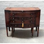 A Regency mahogany bowfront wash stand, with fitted interior on turned supports,