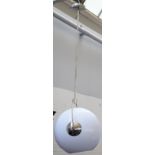 A set of three large chrome hanging lights,