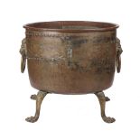 A 19th century copper log bin, of circular riveted form, with twin brass lion mask handles,