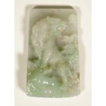 A Chinese jadeite rectangular pendant, carved in high relief with a prowling tiger, 7.75cm high.