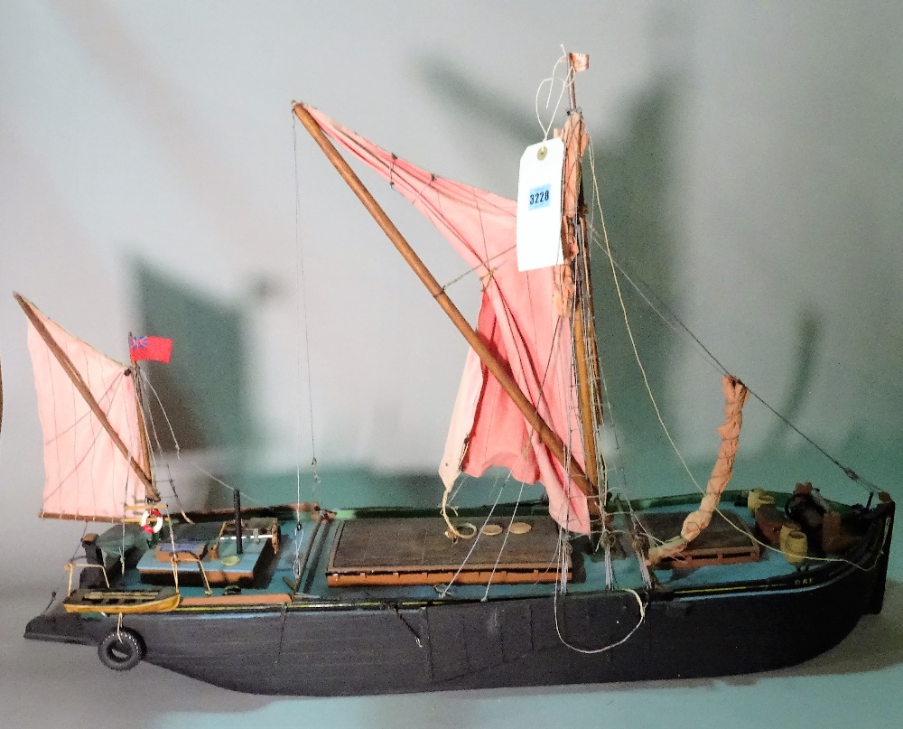 An early 20th century wooden model of a Thames Barge, 99cm wide x 64cm high.