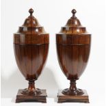 A pair of 19th century inlaid mahogany urn shaped pop-up knife boxes, on square bases,