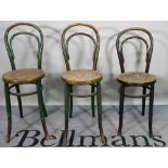 A matched set of three early 20th century bentwood high chairs, 33cm wide x 93cm high.