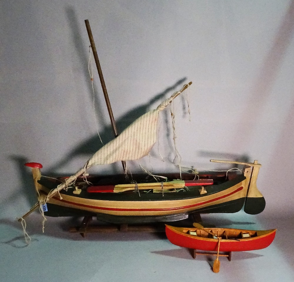 A modern wooden model of a sailing boat, 81cm wide x 26cm high. (a.f.