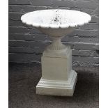 A white painted cast iron urn, on stepped square stand, 60cm diameter x 78cm high.
