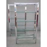 Probably Merrow Associates, a pair of 20th century chrome and glass five tier free standing shelves,