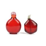 Two Chinese ruby-red glass snuff bottles, 19th/20th century, of discoidal and hexagonal form,
