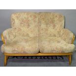Ercol, a modern beech suite comprising of a two seater sofa, 140cm wide x 81cm high,