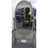 A green and cream painted oval cheval mirror, on leaf carved supports, 98cm wide x 180cm high.
