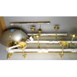 A group of modern brass plate lights, the largest 70cm, and a brass and silvered wall light,