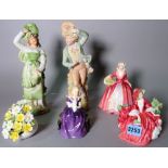 Three ceramic Royal Doulton ladies, a Doulton flower display and a pair of continental figures.