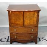 A George III and later mahogany bowfront commode chest, with cupboard doors over two short drawers,