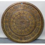 An early 20th century Egyptian style brass circular tray, 75cm diameter.