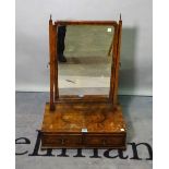 A 19th century walnut toilet mirror, with two frieze drawers on bracket feet.