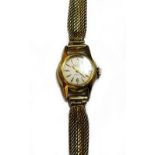 A Longines Automatic gold circular cased lady's wristwatch, with a signed jewelled movement,