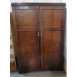 An Edwardian mahogany double wardrobe, on plinth base, 125cm wide x 185cm high.