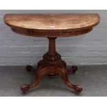 A Victorian inlaid figured walnut semi-elliptic card table, on four carved supports,