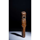 An 18th century novelty nutcracker, carved walnut in the form of a bearded man, 17.5cm high.