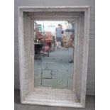 A modern distressed white painted rectangular wall mirror,