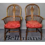 A pair of 19th century ash and elm wheelback Windsor chairs, 57cm wide x 109cm high.