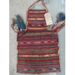 A South Persian bag, the multi coloured narrow bands with some embroidered areas,