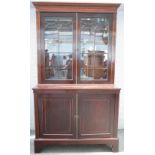 An Edwardian inlaid mahogany secretaire bookcase, the pair of astragal glazed doors,