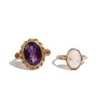A 9ct gold ring, collet set with an oval cut amethyst within a ribbon twist surround, London 1973,