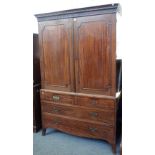 A George III mahogany linen press with a pair of panel doors over two short and two long graduated