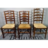 A matched set of six ash and elm ladder back dining chairs, 49cm wide x 86cm high.