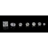 A group of seven unmounted loose diamonds, comprising; five circular cut,