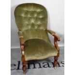 A late Victorian mahogany framed low open armchair, with green button back upholstery.