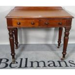 A Victorian style mahogany two drawer writing table, on ring turned supports, 91cm wide x 80cm high.
