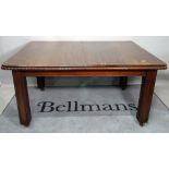 A Regency style mahogany extending dining table, on block supports, one extra leaf,