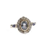 A 14ct gold, sapphire and diamond oval cluster ring,
