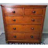 A late Victorian mahogany chest, of two short and three long drawers on bun feet,