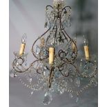 A Victorian style glass and metal five branch chandelier, 56cm wide x 55cm high.