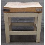 A rectangular beech butchers block, on painted square supports, 93cm wide x 100cm high.