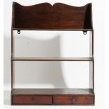 A set of George III mahogany hanging waterfall three tier wall shelves, with a pair of drawers,