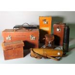 A collection of leather cased items including a brass telescope, a Rolleiflex camera,