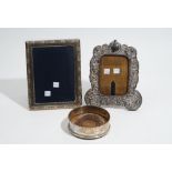 Silver mounted wares, comprising; a rectangular photograph frame, with a decorated border,