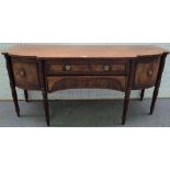 A large Regency mahogany bowfront sideboard, with four frieze drawers on reeded supports,