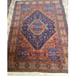 A Mahal rug, Persian, the indigo diamond field with a madder medallion,